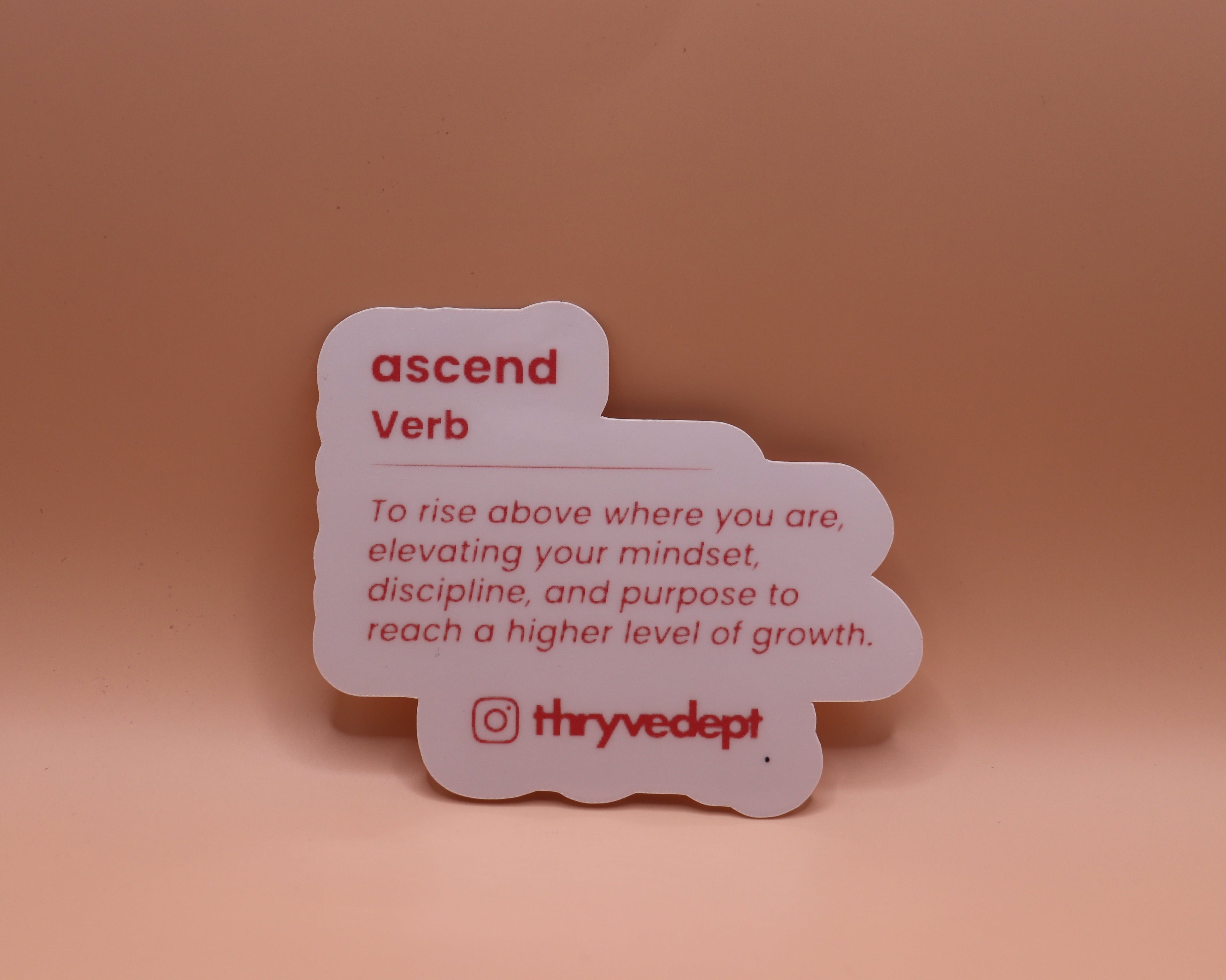 Card with the word 'ascend' and its definition on a peach background